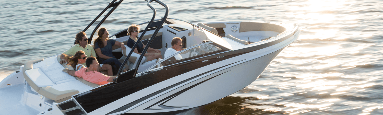 Family riding in a 2018 Glastron GT185 DS boat through the water